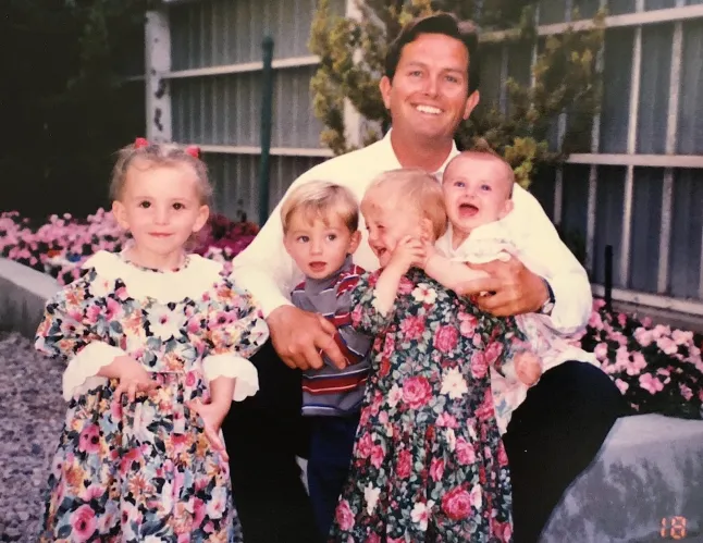 Janet with her father and siblings. // A woman who grew up in a polygamous 